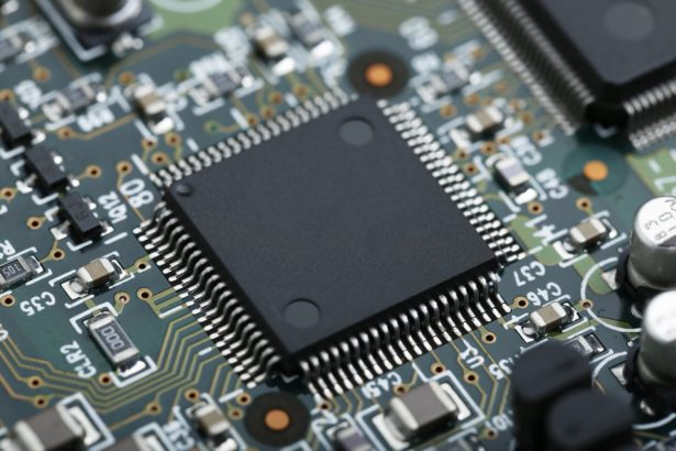 Closeup of electronic circuit board with CPU microchip electronic components background